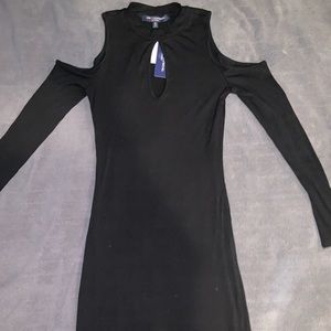 form fitting black long dress with cutout at top